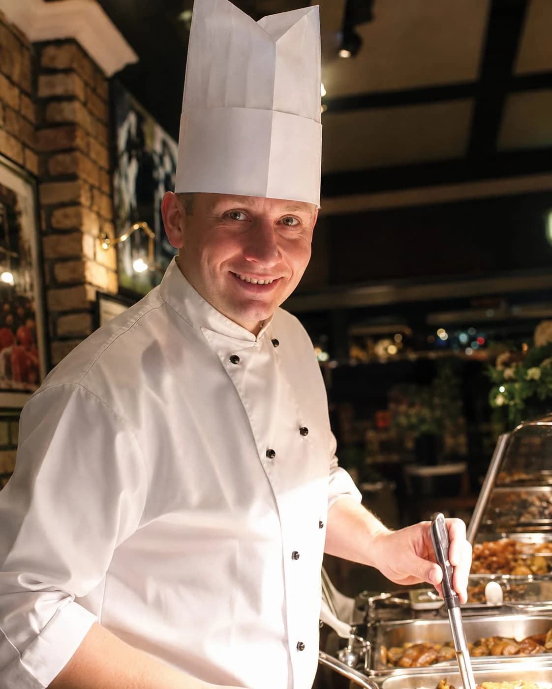 Adam Skinner working a carvery service earlier in his career